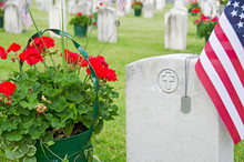 Dog Tags On Veteran's Grave