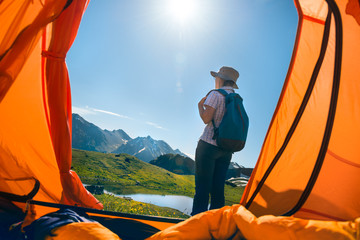 Wall Mural - woman camping in mountains
