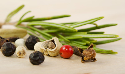 fragrant scented natural spices with a sprig of rosemary on the