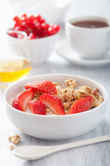 healthy breakfast with granola and strawberry