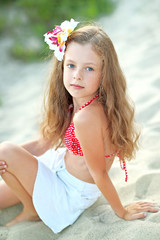 Wall Mural - portrait of little girl on the beach