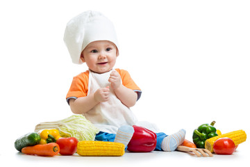 Wall Mural - smiling baby cook with vegetables