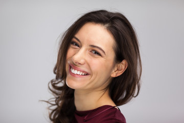 woman face smile, close up gray background