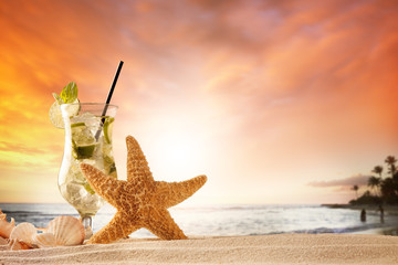 Wall Mural - Summer beach with ice drink, seastar and shells