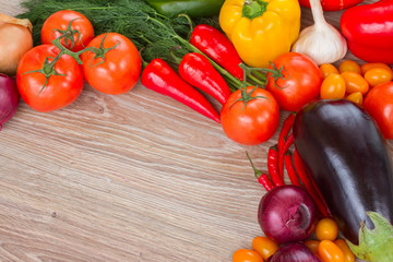 Wall Mural - border of fresh vegetables on table