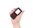 © indigolotos - Hand holds red-black cell phone.