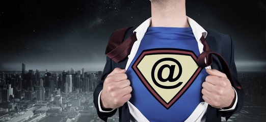 Poster - Composite image of businessman opening shirt in superhero style
