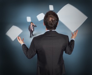 Poster - Composite image of gesturing businessman with tiny businessman