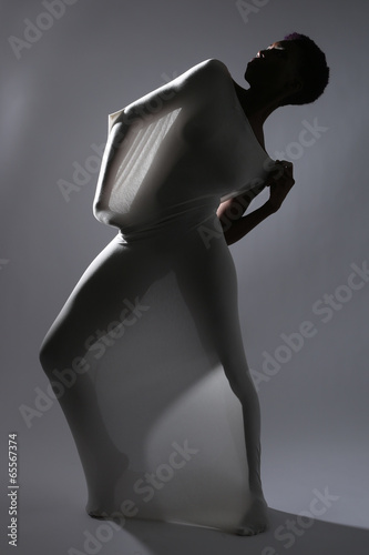 Fotomural Shapely Woman in Creative Light and Spandex Fabric