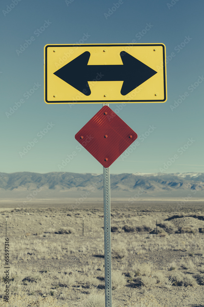 Around Direction Sign Directional arrow sign along rural road near Orvada. Stock Photo ...