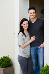 happy young couple welcome in new home