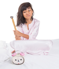 Wall Mural - Irritated young  girl waking up from sleep and destroy clock