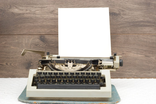 typewriter on wooden background