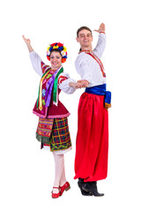 Wall Mural - beautiful dancing couple in ukrainian polish national