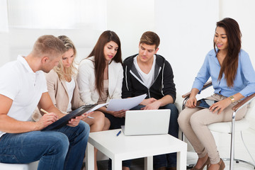 Wall Mural - Businesspeople Discussing In Office