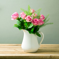 Wall Mural - Rose flower bouquet in white jug on wooden table