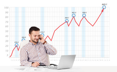 Businessman calculating stock market with rising graph in the ba