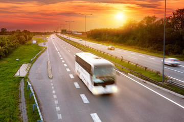 Poster - White bus in the rush hour on the highway