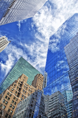 Nowoczesny obraz na płótnie Skyscrapers with clouds reflection