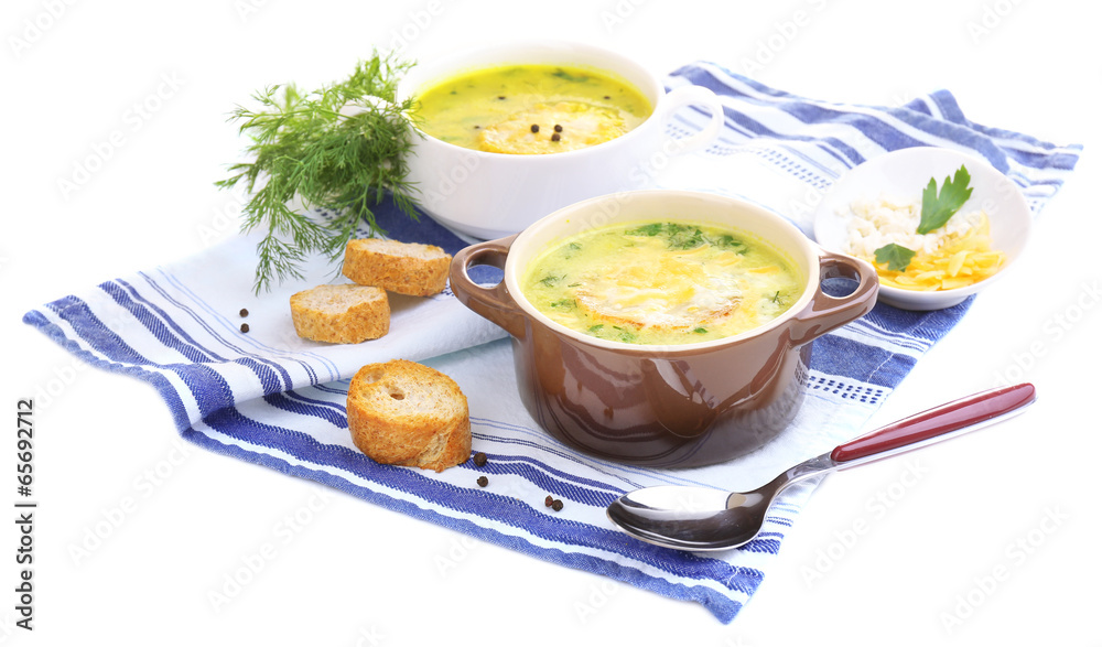 Tasty soup in saucepans, isolated on white