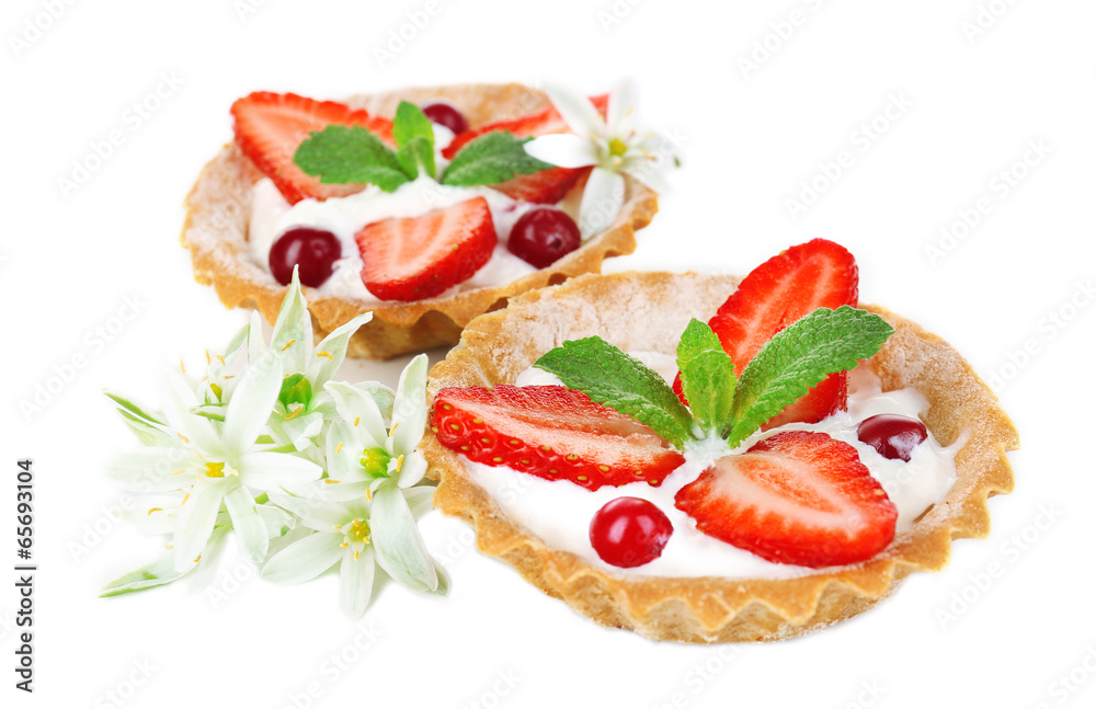 Tasty tartlets with strawberries isolated on white