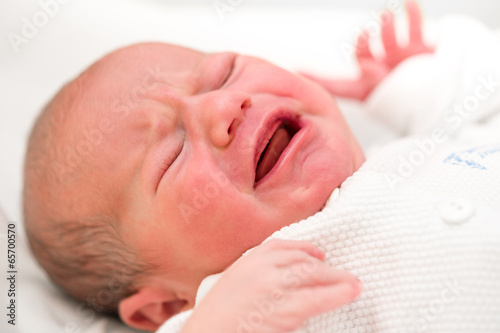 Crying newborn baby in the hospital Crying newborn baby in the hospital