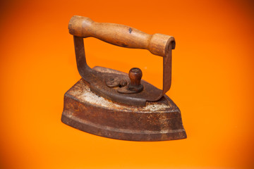 old iron on a orange background