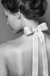 Beautiful gentle girl with silk bow on the back