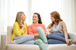 © Syda Productions - three girlfriends having a talk at home
