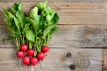 Bunch Of Radishes On Wooden Background