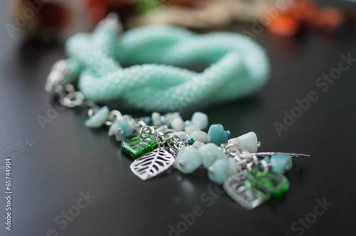 Fotografie, Obraz Knitted necklace of mint color with a suspension bracket