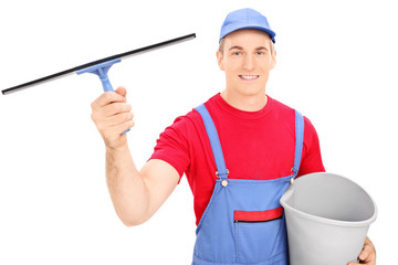 Canvas Print - Male window cleaner holding a bucket