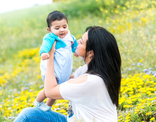 young mother playing with her baby