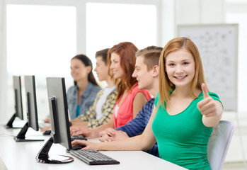 Wall Mural - female student with classmates in computer class