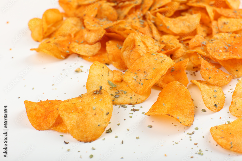 Homemade potato chips isolated on white
