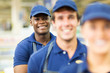 © michaeljung - afro american hardware store worker with colleagues