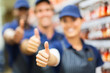 group of hardware store co-workers thumbs up