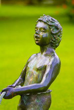 Close Up To A Child Emerald Statue