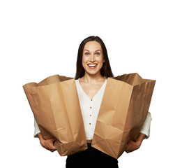 Wall Mural - beautiful excited woman with paper bags