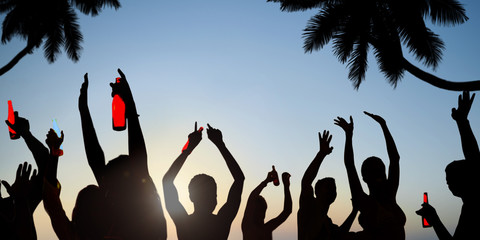 Wall Mural - Silhouettes of Young People Celebrating, Drinking on a Beach