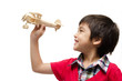 © wckiw - little boy playing with a toy airplane. Isolated on white backgr