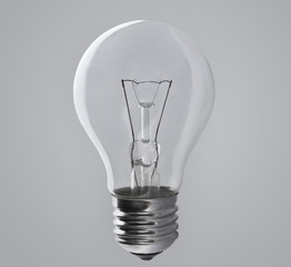 Wall Mural - Light bulb lamp on grey background