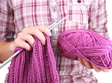 Female Hands Knitting With Spokes Close Up