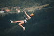 © zorandim75 - Adult woman on zip line