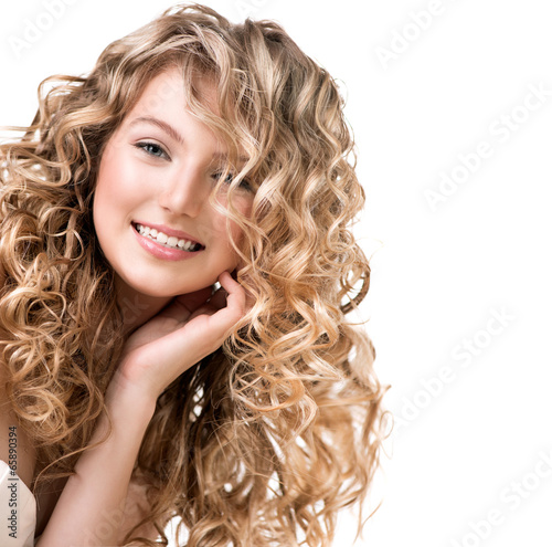 Cuadros en Lienzo Beauty girl with blonde curly hair. Long permed hair
