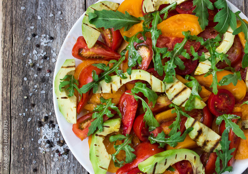 Fototapeta do kuchni Salad of grilled avocado and multicolored tomatoes