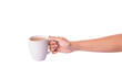 Woman hand holding a mug of coffee with creamer 