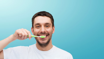 Canvas Print - smiling young man with toothbrush