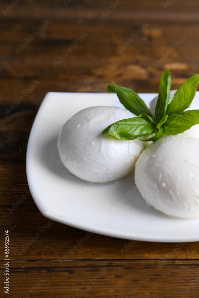 Tasty mozzarella cheese with basil