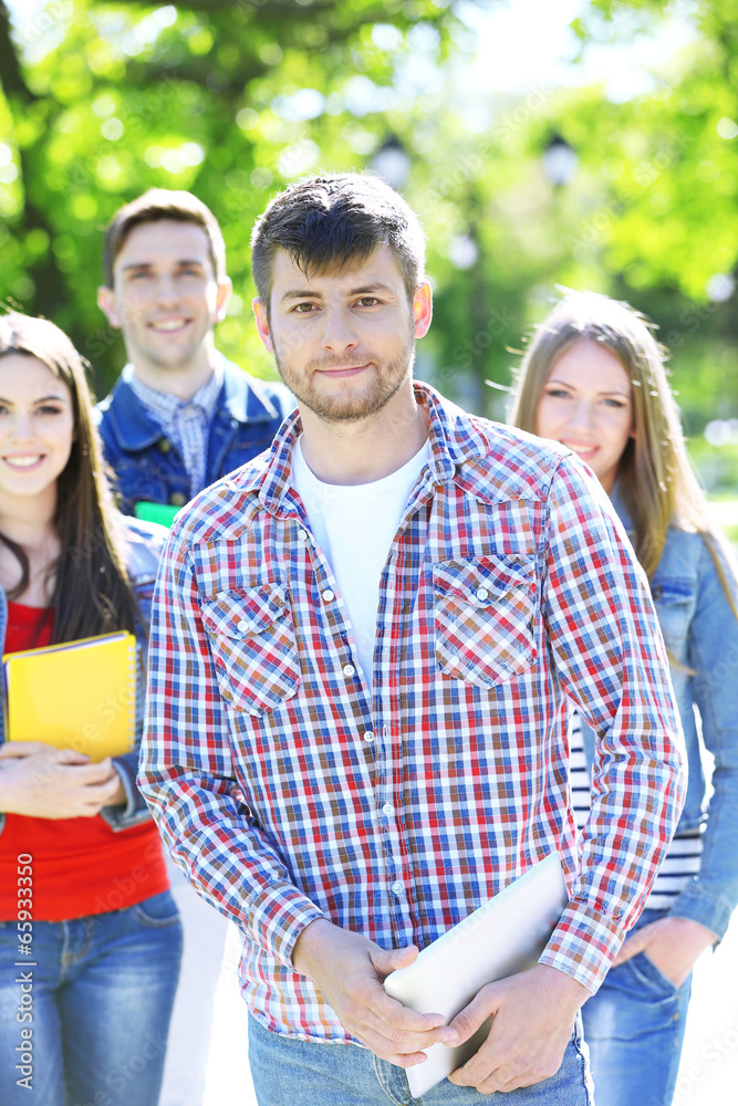 Happy students in park